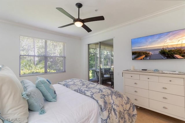 bedroom featuring access to exterior, multiple windows, ceiling fan, and ornamental molding