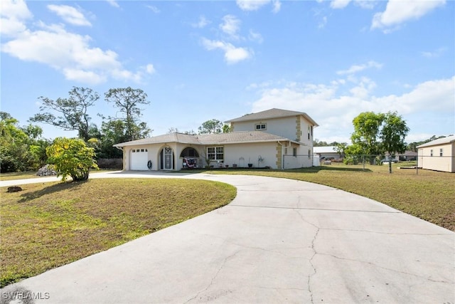 view of front of home with a garage and a front yard