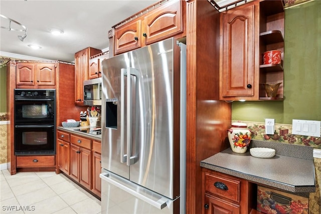 kitchen featuring light tile patterned floors and black appliances