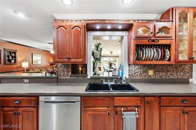 kitchen with crown molding, sink, stainless steel dishwasher, and backsplash