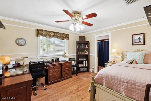 bedroom with crown molding, ceiling fan, and light hardwood / wood-style floors