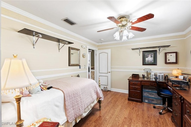 bedroom featuring ornamental molding, light hardwood / wood-style floors, and ceiling fan