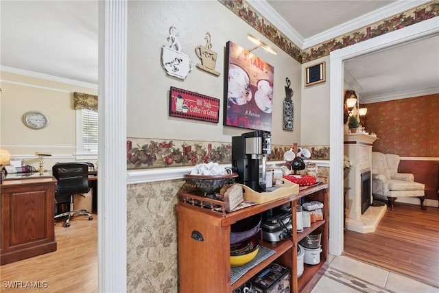 office space with crown molding and light hardwood / wood-style floors