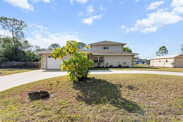 view of front of house with a garage and a front lawn