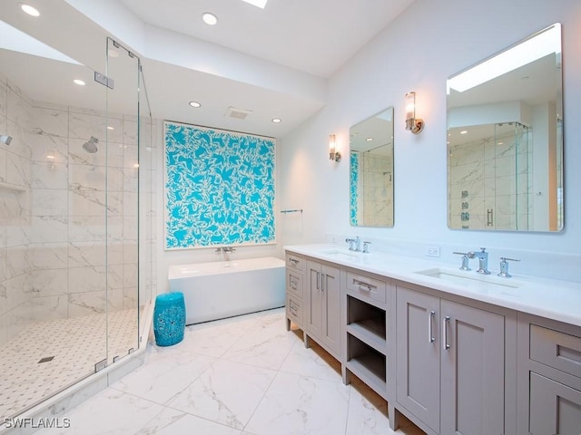 bathroom with vanity and independent shower and bath