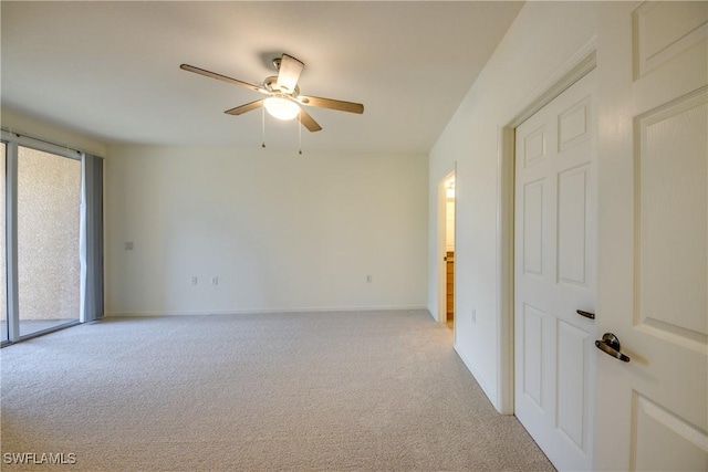 carpeted empty room with ceiling fan