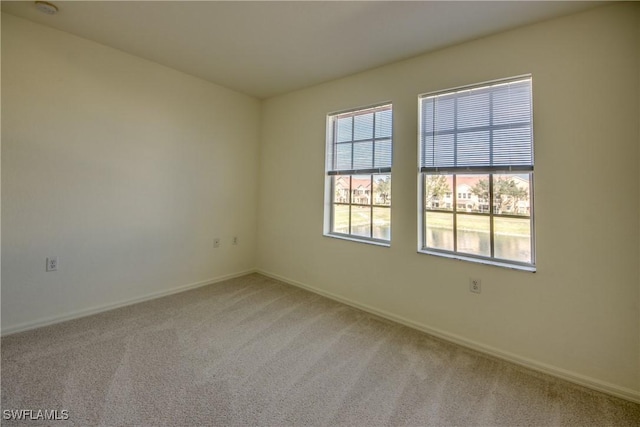 empty room with light colored carpet