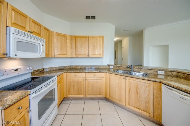 kitchen with white appliances, light stone counters, sink, light tile patterned flooring, and light brown cabinets