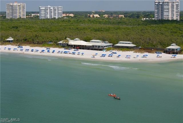 birds eye view of property featuring a view of the beach and a water view