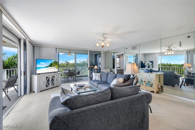 carpeted living room featuring a wall of windows and a wealth of natural light