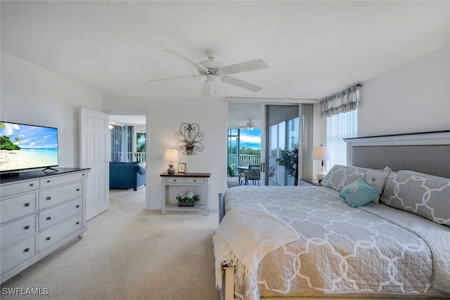 carpeted bedroom with ceiling fan, floor to ceiling windows, and access to exterior