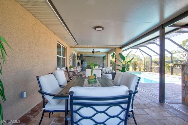 view of patio / terrace featuring glass enclosure