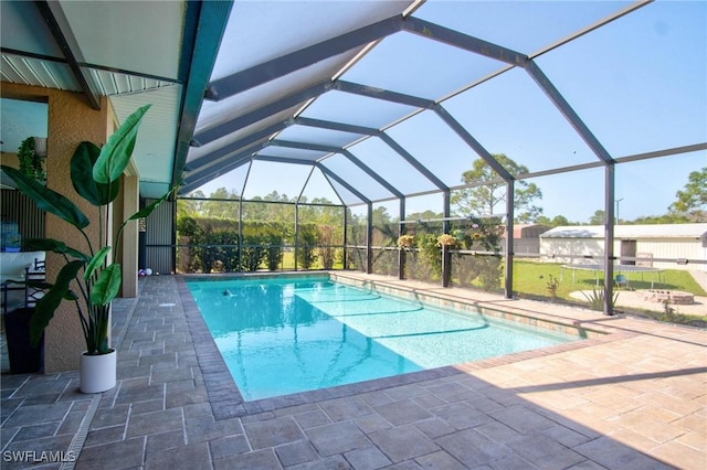 view of pool with a lanai and a patio