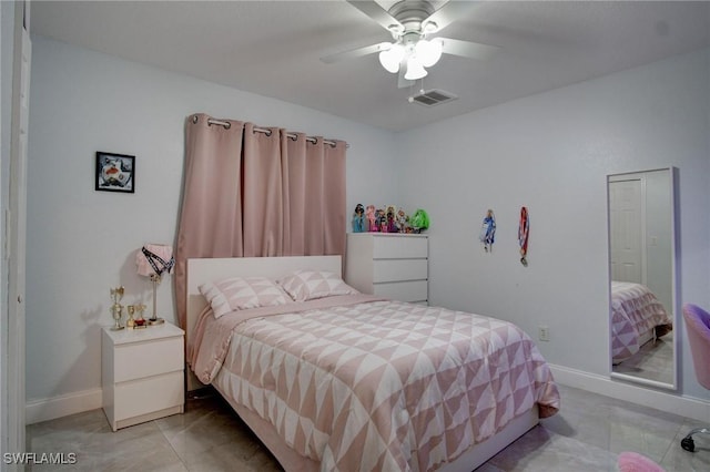 tiled bedroom with ceiling fan