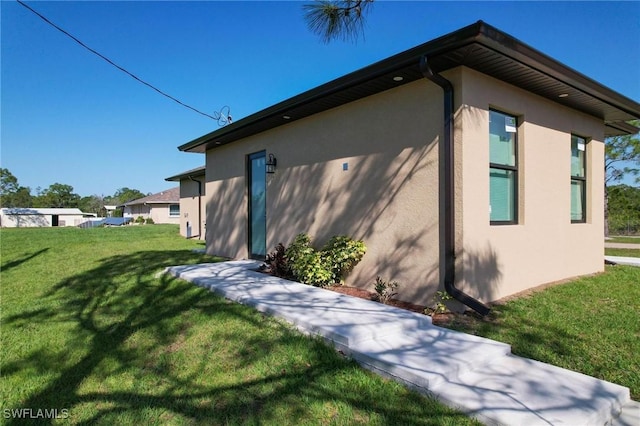 view of home's exterior featuring a lawn