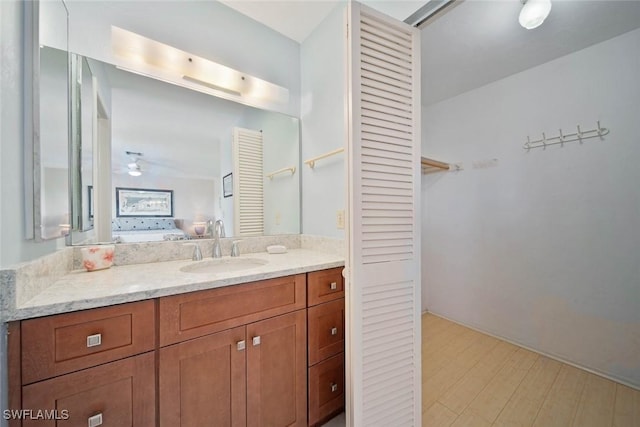 bathroom with vanity and ceiling fan