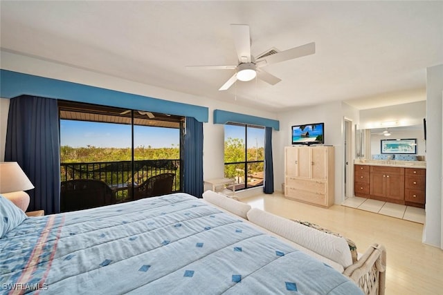 bedroom with ceiling fan, access to exterior, light wood-type flooring, and connected bathroom