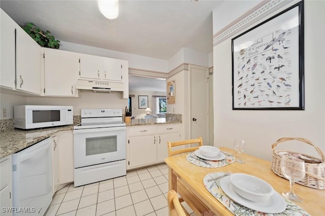 kitchen featuring white cabinetry, light stone countertops, white appliances, and light tile patterned floors