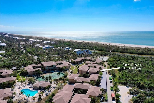 bird's eye view with a water view and a view of the beach