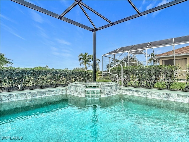 view of pool featuring glass enclosure