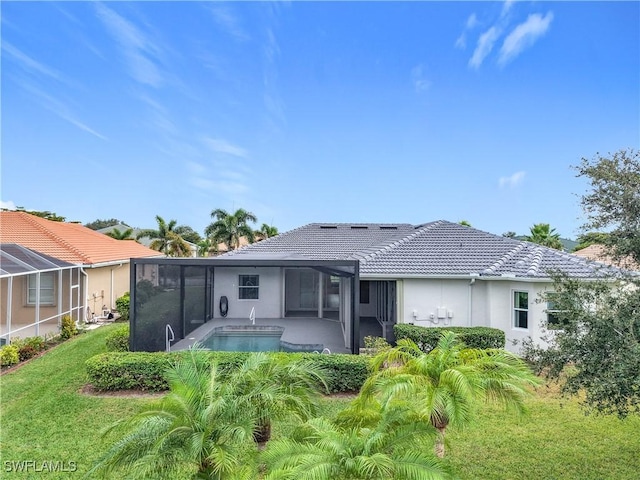 back of house with a lanai and a patio area