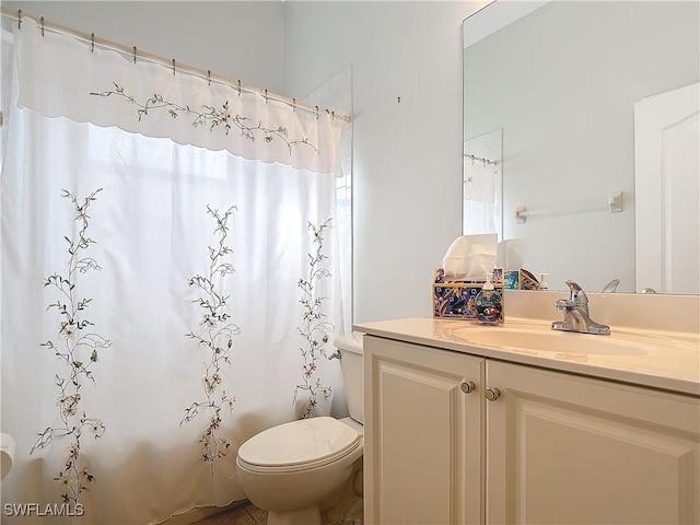 full bathroom featuring vanity, toilet, and shower / bath combo with shower curtain