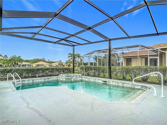 view of pool featuring glass enclosure