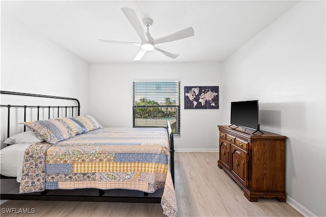 bedroom with ceiling fan and light hardwood / wood-style floors