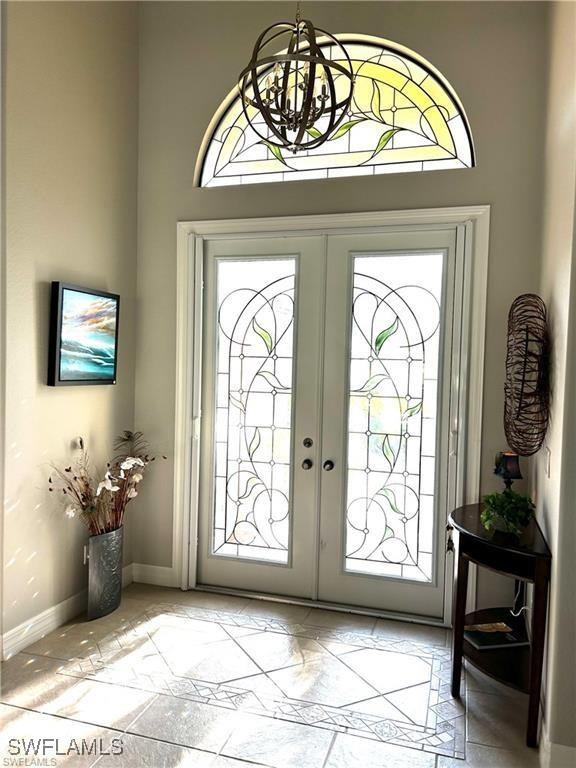 foyer with french doors and a healthy amount of sunlight