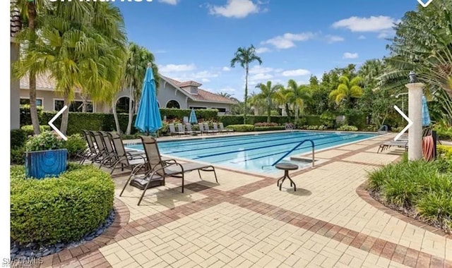 view of swimming pool featuring a patio area