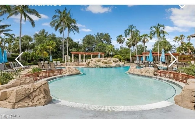 view of pool featuring a pergola and a patio