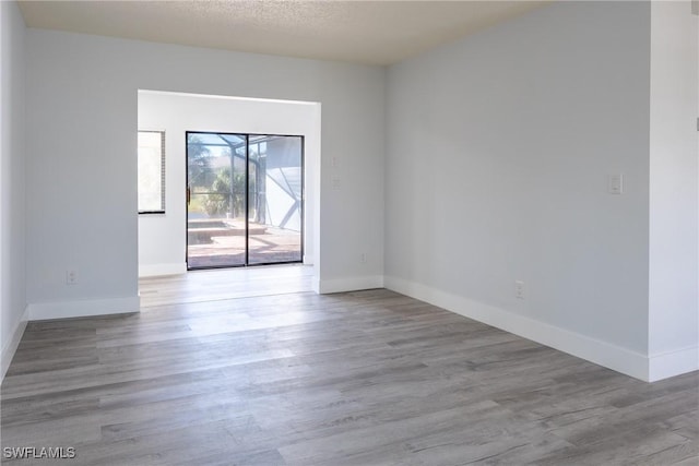 unfurnished room featuring light wood-type flooring