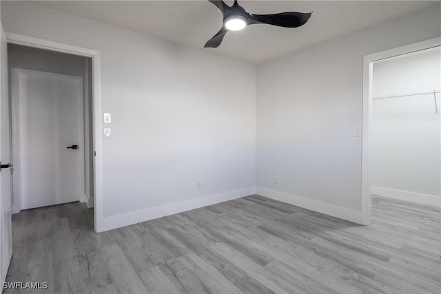 spare room featuring ceiling fan and light wood-type flooring