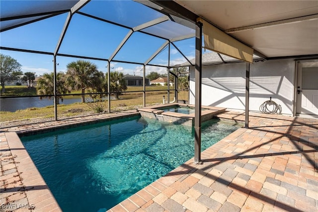 view of swimming pool with a patio, a lanai, a water view, and an in ground hot tub