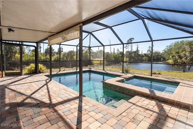 view of pool featuring an in ground hot tub, a water view, a lanai, and a patio