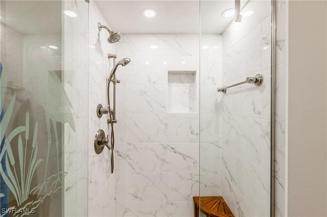 bathroom with tiled shower