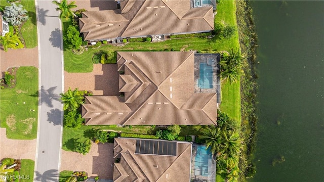 drone / aerial view with a water view