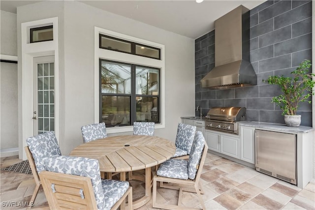 view of patio / terrace featuring an outdoor kitchen, grilling area, and sink