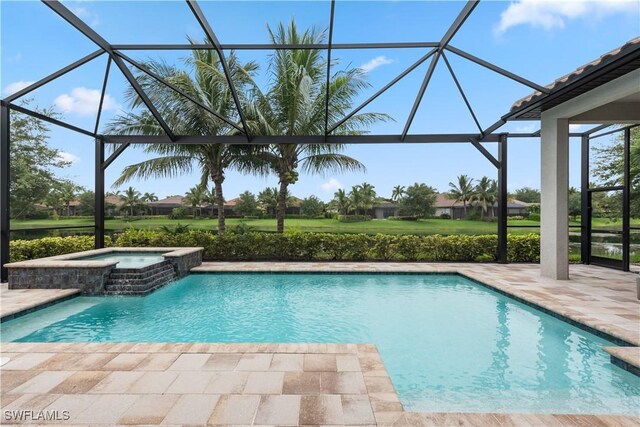 view of swimming pool with glass enclosure, an in ground hot tub, and a patio