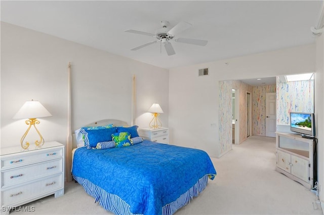 bedroom featuring ceiling fan and light carpet