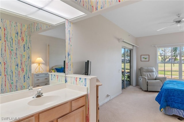 bathroom featuring ceiling fan and vanity