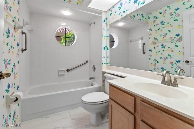 full bathroom with toilet, vanity, and tiled shower / bath