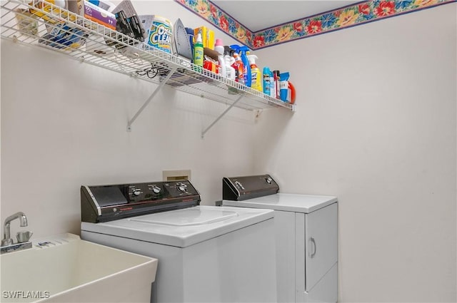 laundry area featuring sink and independent washer and dryer