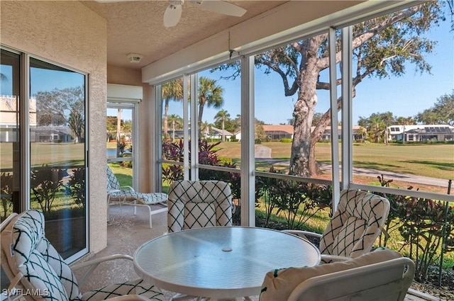 sunroom / solarium with ceiling fan