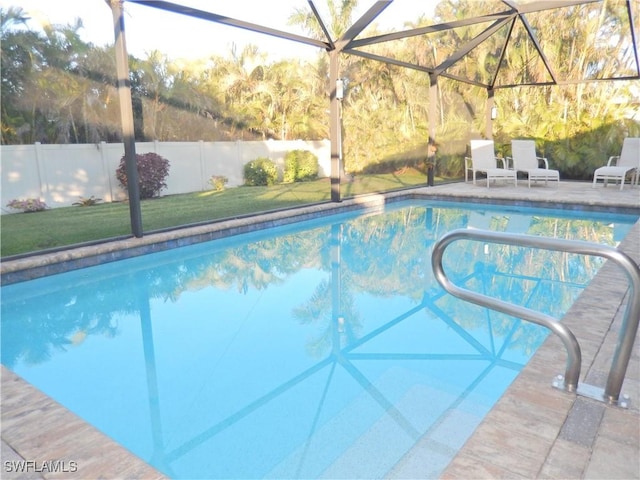 view of pool featuring a lanai