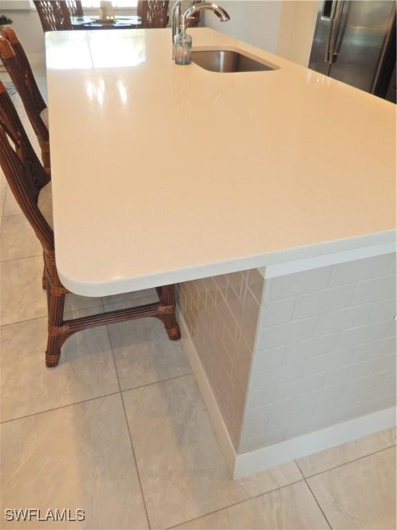 interior details with stainless steel fridge and sink