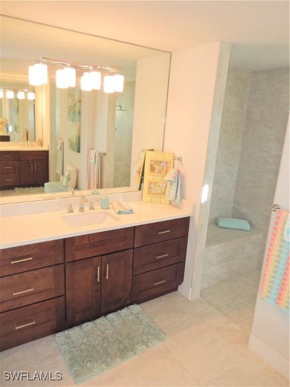 bathroom with tile patterned floors and vanity