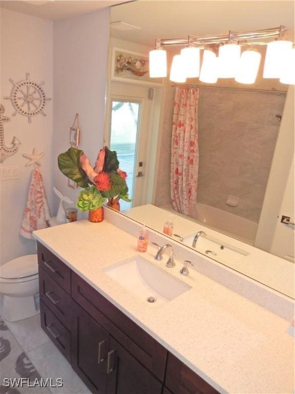 full bathroom featuring tile patterned floors, vanity, shower / tub combo, and toilet