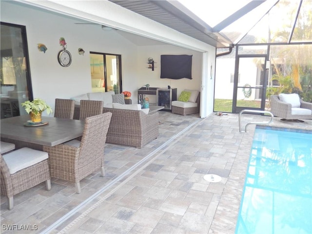 view of patio with a lanai and an outdoor living space