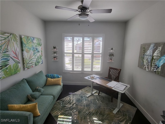 office with plenty of natural light and ceiling fan